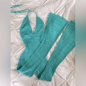 Fitted romper. Teal. Bell bottom. New w tags. Summer. Backless. Ties around neck